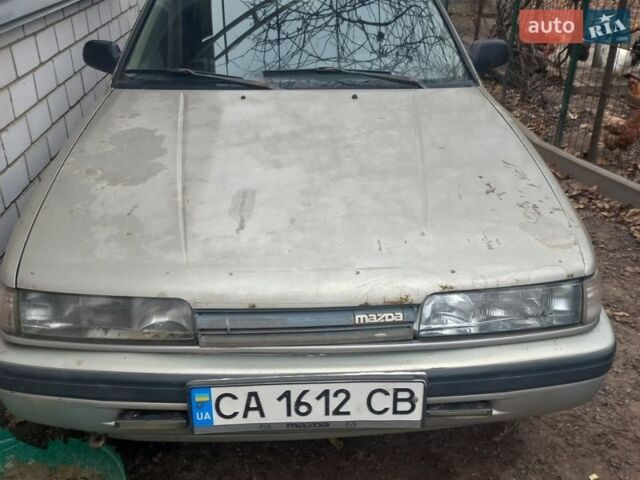 Серый Мазда 626, объемом двигателя 1.8 л и пробегом 380 тыс. км за 700 $, фото 1 на Automoto.ua