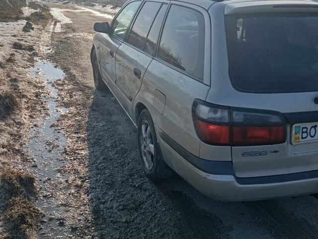 Серый Мазда 626, объемом двигателя 2 л и пробегом 320 тыс. км за 1353 $, фото 1 на Automoto.ua