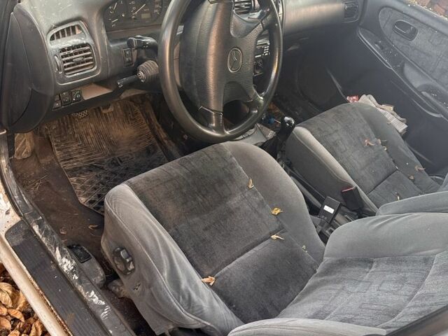 Серый Мазда 626, объемом двигателя 1.8 л и пробегом 200 тыс. км за 600 $, фото 1 на Automoto.ua