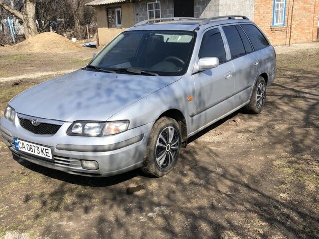 Серый Мазда 626, объемом двигателя 1.8 л и пробегом 250 тыс. км за 3000 $, фото 1 на Automoto.ua