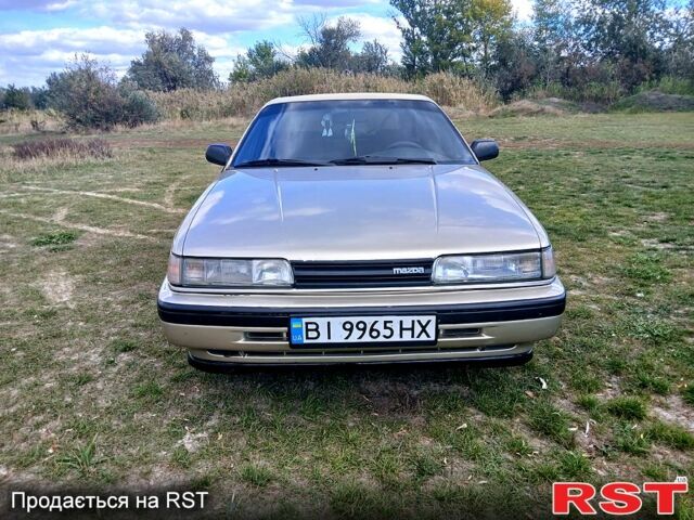 Серый Мазда 626, объемом двигателя 2 л и пробегом 370 тыс. км за 1950 $, фото 1 на Automoto.ua