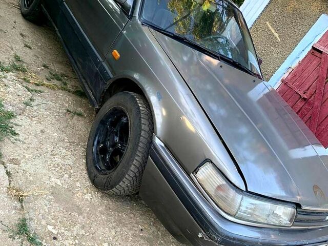 Серый Мазда 626, объемом двигателя 1.8 л и пробегом 600 тыс. км за 1050 $, фото 1 на Automoto.ua