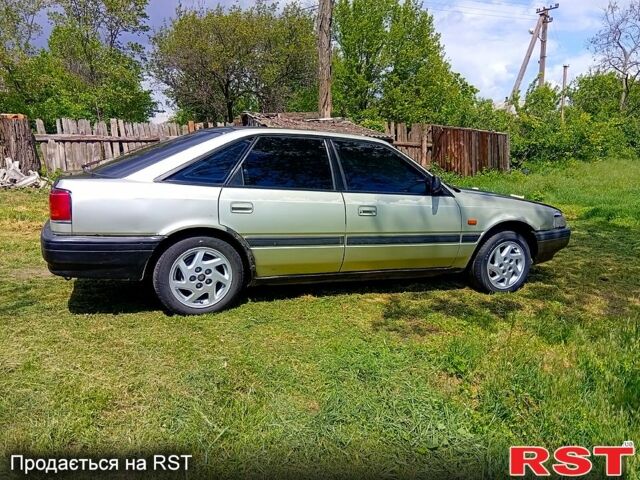 Серый Мазда 626, объемом двигателя 2.2 л и пробегом 200 тыс. км за 410 $, фото 1 на Automoto.ua