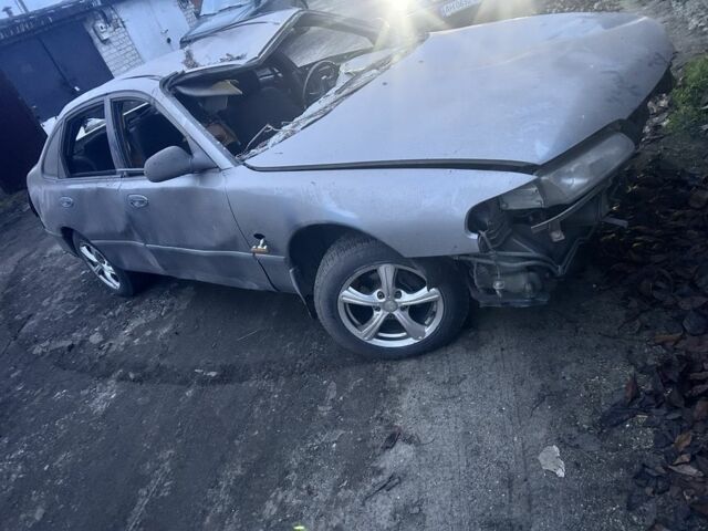 Серый Мазда 626, объемом двигателя 1.8 л и пробегом 100 тыс. км за 300 $, фото 1 на Automoto.ua