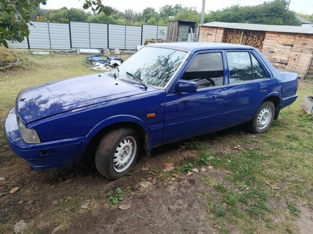 Синий Мазда 626, объемом двигателя 0 л и пробегом 300 тыс. км за 447 $, фото 1 на Automoto.ua
