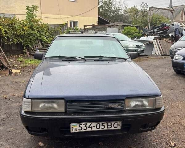 Синий Мазда 626, объемом двигателя 2 л и пробегом 400 тыс. км за 700 $, фото 1 на Automoto.ua