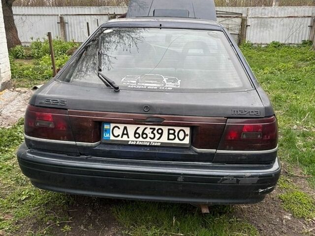 Синий Мазда 626, объемом двигателя 2 л и пробегом 300 тыс. км за 1000 $, фото 1 на Automoto.ua