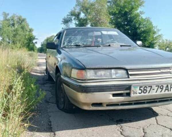 Синий Мазда 626, объемом двигателя 2 л и пробегом 300 тыс. км за 650 $, фото 1 на Automoto.ua