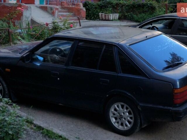 Синий Мазда 626, объемом двигателя 1.59 л и пробегом 309 тыс. км за 1200 $, фото 1 на Automoto.ua