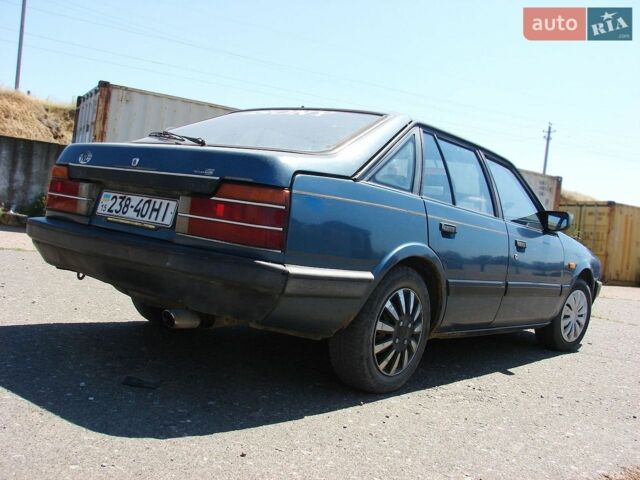 Синий Мазда 626, объемом двигателя 1.6 л и пробегом 340 тыс. км за 800 $, фото 1 на Automoto.ua