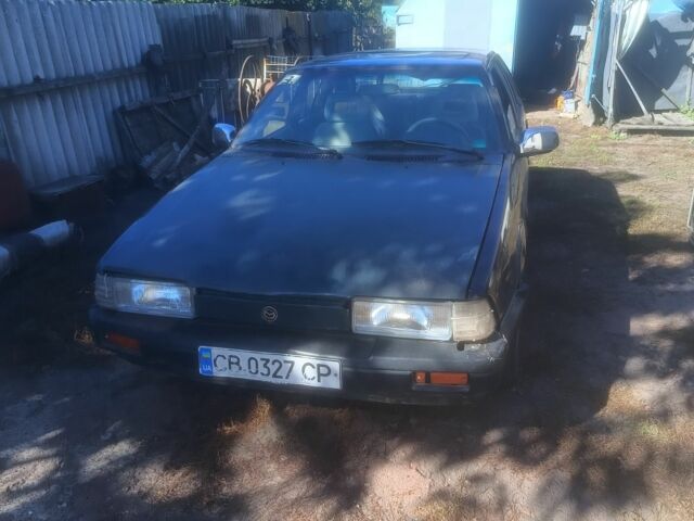 Синий Мазда 626, объемом двигателя 2 л и пробегом 220 тыс. км за 603 $, фото 1 на Automoto.ua