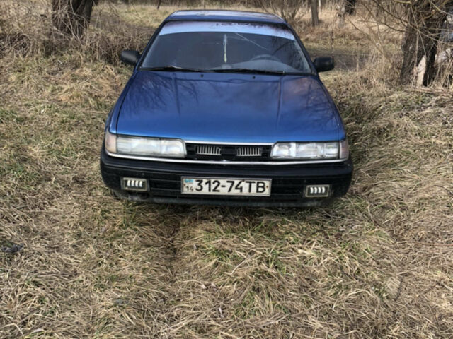Синий Мазда 626, объемом двигателя 2 л и пробегом 450 тыс. км за 1000 $, фото 1 на Automoto.ua