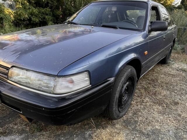 Синий Мазда 626, объемом двигателя 2 л и пробегом 498 тыс. км за 895 $, фото 1 на Automoto.ua