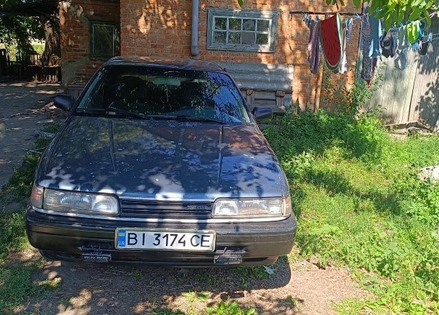 Синий Мазда 626, объемом двигателя 2 л и пробегом 520 тыс. км за 1118 $, фото 1 на Automoto.ua