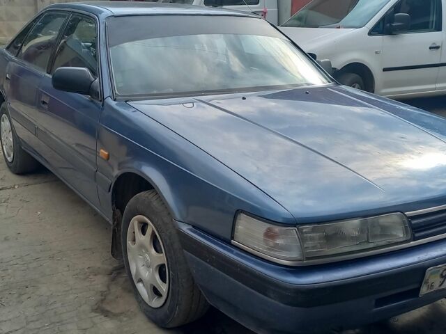 Синий Мазда 626, объемом двигателя 2 л и пробегом 300 тыс. км за 985 $, фото 1 на Automoto.ua