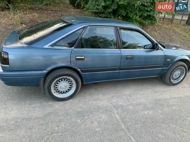 Синий Мазда 626, объемом двигателя 2 л и пробегом 400 тыс. км за 1000 $, фото 1 на Automoto.ua