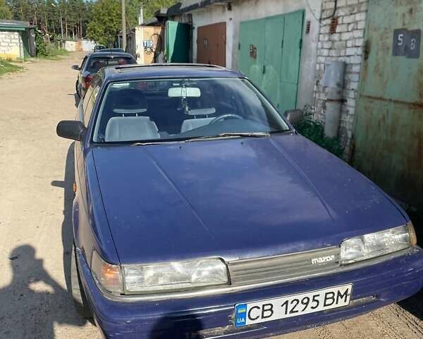 Синий Мазда 626, объемом двигателя 2 л и пробегом 137 тыс. км за 1000 $, фото 1 на Automoto.ua