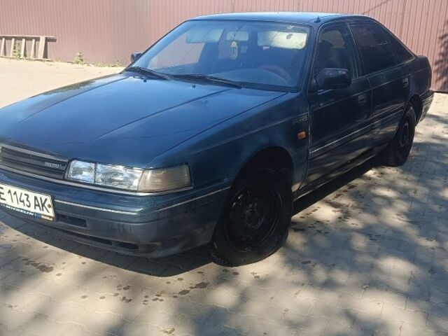 Синий Мазда 626, объемом двигателя 2 л и пробегом 320 тыс. км за 752 $, фото 1 на Automoto.ua