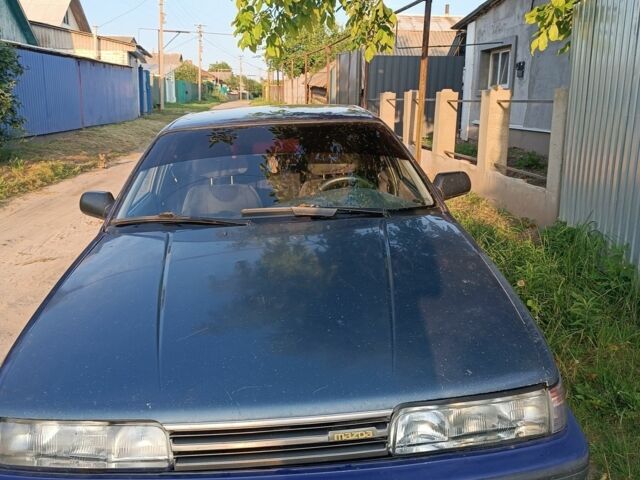 Синій Мазда 626, об'ємом двигуна 2 л та пробігом 300 тис. км за 1101 $, фото 1 на Automoto.ua