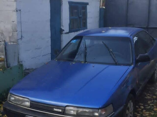 Синий Мазда 626, объемом двигателя 2 л и пробегом 333 тыс. км за 600 $, фото 1 на Automoto.ua