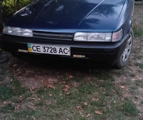 Синий Мазда 626, объемом двигателя 0 л и пробегом 200 тыс. км за 649 $, фото 1 на Automoto.ua