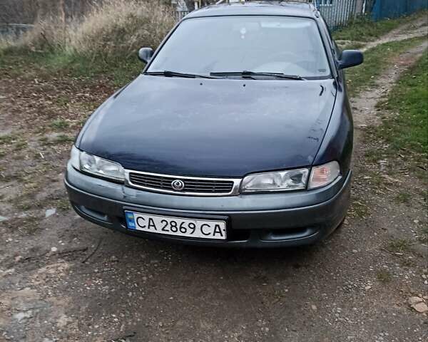 Синий Мазда 626, объемом двигателя 1.8 л и пробегом 444 тыс. км за 1600 $, фото 1 на Automoto.ua