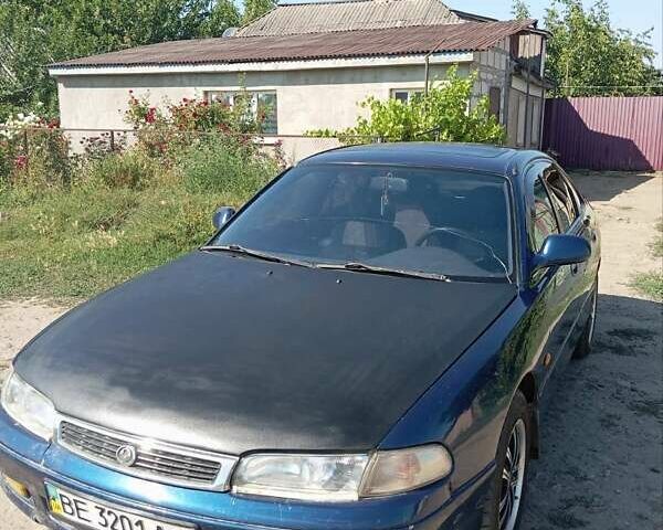 Синий Мазда 626, объемом двигателя 1.8 л и пробегом 300 тыс. км за 2100 $, фото 1 на Automoto.ua