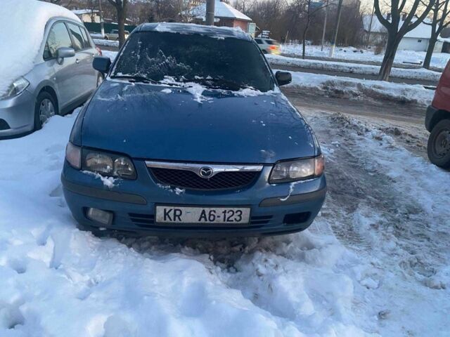 Синий Мазда 626, объемом двигателя 2 л и пробегом 222 тыс. км за 700 $, фото 1 на Automoto.ua