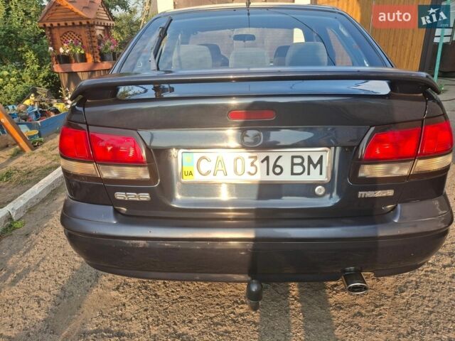 Синий Мазда 626, объемом двигателя 2 л и пробегом 381 тыс. км за 2500 $, фото 1 на Automoto.ua