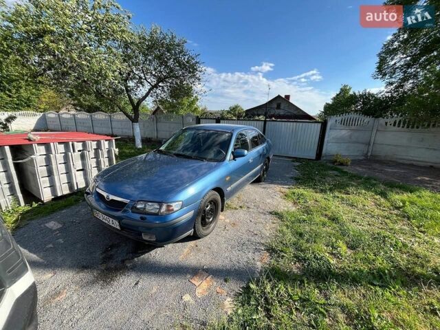 Синий Мазда 626, объемом двигателя 1.8 л и пробегом 425 тыс. км за 1550 $, фото 1 на Automoto.ua