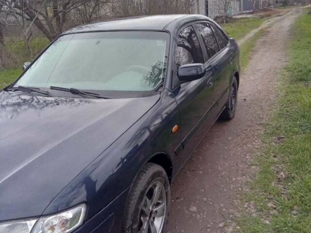 Синий Мазда 626, объемом двигателя 2 л и пробегом 320 тыс. км за 2800 $, фото 1 на Automoto.ua