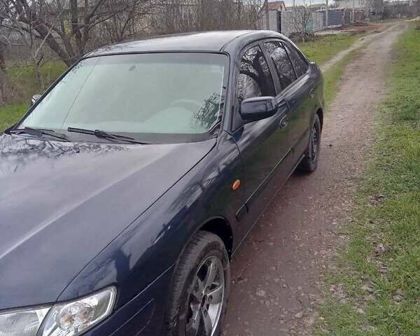 Синий Мазда 626, объемом двигателя 2 л и пробегом 320 тыс. км за 2700 $, фото 1 на Automoto.ua