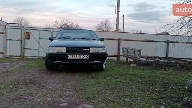 Синий Мазда 626, объемом двигателя 2 л и пробегом 370 тыс. км за 950 $, фото 1 на Automoto.ua