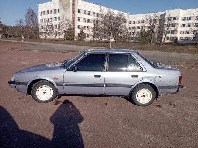 Синій Мазда 626, об'ємом двигуна 2 л та пробігом 400 тис. км за 700 $, фото 1 на Automoto.ua