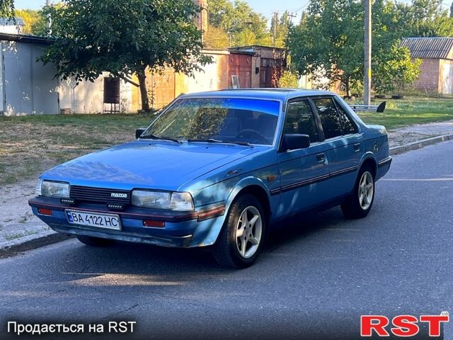 Синий Мазда 626, объемом двигателя 1.8 л и пробегом 222 тыс. км за 950 $, фото 1 на Automoto.ua
