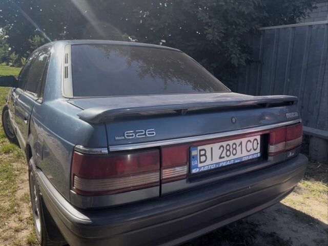 Синий Мазда 626, объемом двигателя 2 л и пробегом 500 тыс. км за 803 $, фото 1 на Automoto.ua