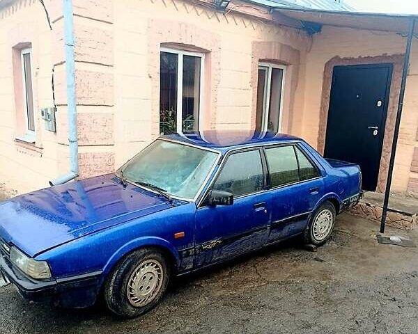 Синій Мазда 626, об'ємом двигуна 2 л та пробігом 200 тис. км за 300 $, фото 1 на Automoto.ua