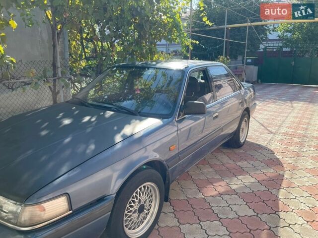 Синий Мазда 626, объемом двигателя 2 л и пробегом 385 тыс. км за 1000 $, фото 1 на Automoto.ua
