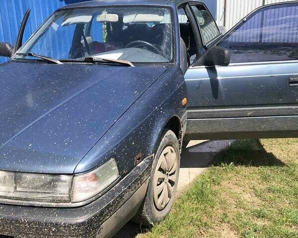 Синий Мазда 626, объемом двигателя 2 л и пробегом 360 тыс. км за 1000 $, фото 1 на Automoto.ua