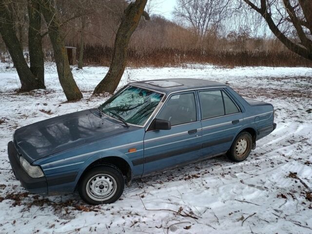 Синий Мазда 626, объемом двигателя 2 л и пробегом 300 тыс. км за 926 $, фото 1 на Automoto.ua