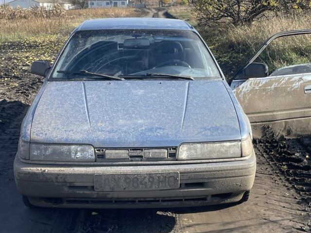 Синій Мазда 626, об'ємом двигуна 2 л та пробігом 300 тис. км за 714 $, фото 1 на Automoto.ua