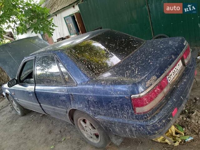 Синий Мазда 626, объемом двигателя 1.79 л и пробегом 200 тыс. км за 900 $, фото 1 на Automoto.ua