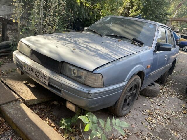 Синий Мазда 626, объемом двигателя 2 л и пробегом 150 тыс. км за 607 $, фото 1 на Automoto.ua