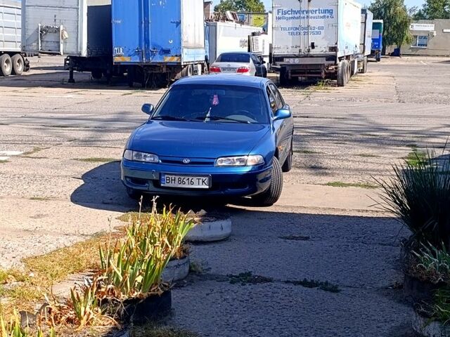 Синий Мазда 626, объемом двигателя 1.8 л и пробегом 150 тыс. км за 1100 $, фото 1 на Automoto.ua