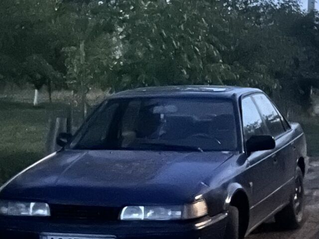 Синий Мазда 626, объемом двигателя 2 л и пробегом 280 тыс. км за 301 $, фото 1 на Automoto.ua