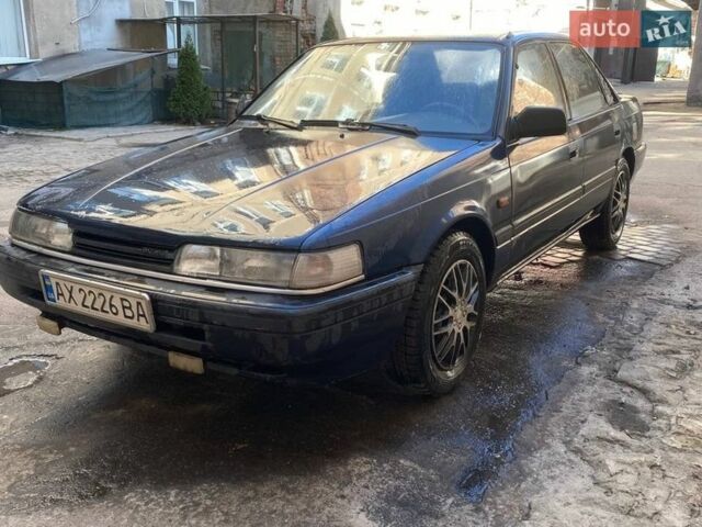 Синий Мазда 626, объемом двигателя 1.8 л и пробегом 300 тыс. км за 1500 $, фото 1 на Automoto.ua