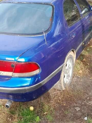 Синий Мазда 626, объемом двигателя 2 л и пробегом 300 тыс. км за 1100 $, фото 1 на Automoto.ua