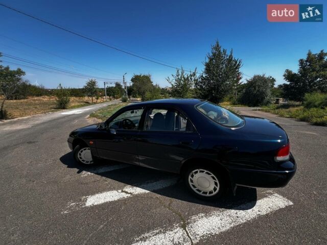 Синий Мазда 626, объемом двигателя 2 л и пробегом 200 тыс. км за 3600 $, фото 1 на Automoto.ua