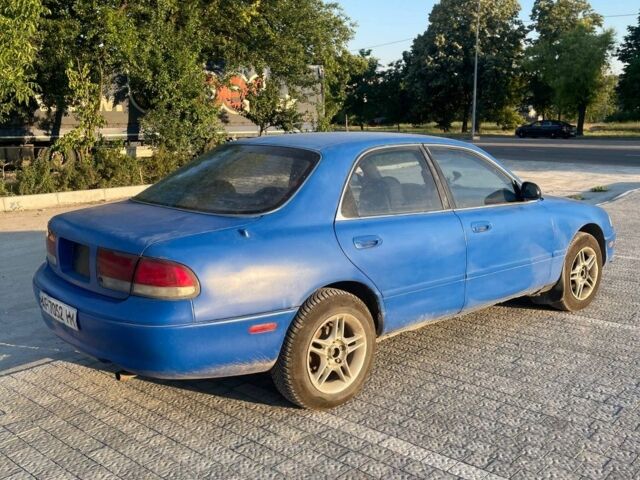 Синий Мазда 626, объемом двигателя 2 л и пробегом 300 тыс. км за 1239 $, фото 1 на Automoto.ua