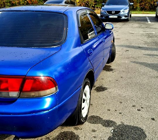 Синий Мазда 626, объемом двигателя 1.8 л и пробегом 461 тыс. км за 1700 $, фото 1 на Automoto.ua